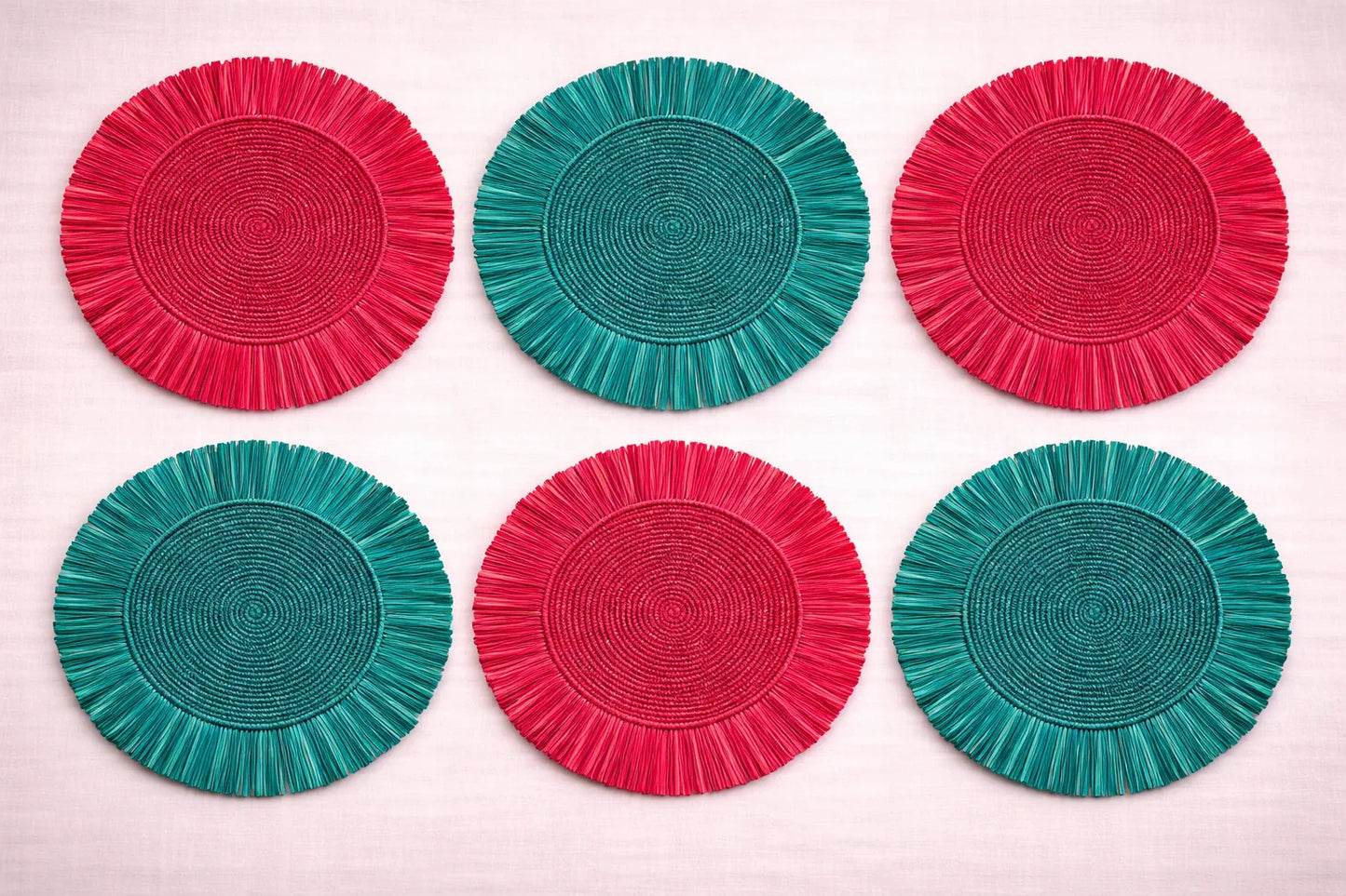 Holiday Cheer festive table setting featuring a handwoven charger plate with Christmas-themed in red and green bohemian accessories.