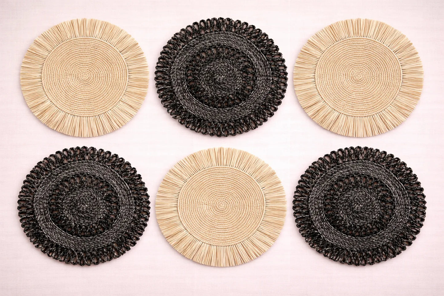 Natural Contrast table setting featuring black and white beige handwoven raffia and abaca charger plates with minimalist boho accessories.