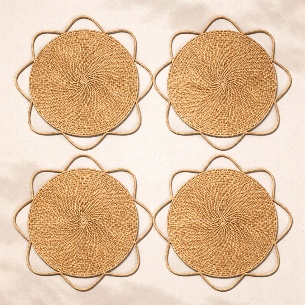 A variety of handwoven Fleur Medallion charger plates with intricate floral patterns for vintage-style bohemian dining.
