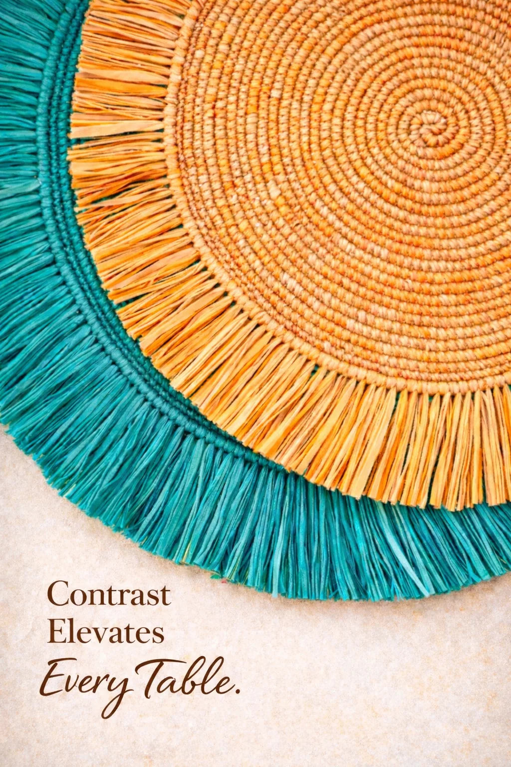 Two woven placemats, one teal and one orange, on a textured surface with text 'Contrast Elevates Every Table'.