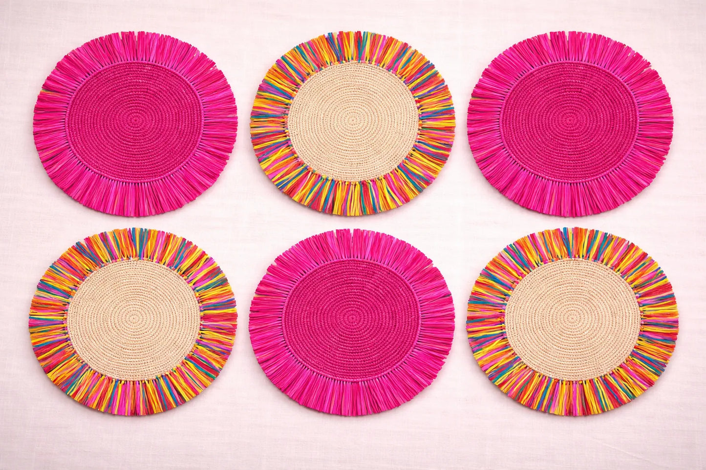 Confetti Sprinkles festive table setting featuring multicolored handwoven charger plates and playful bohemian party accessories.