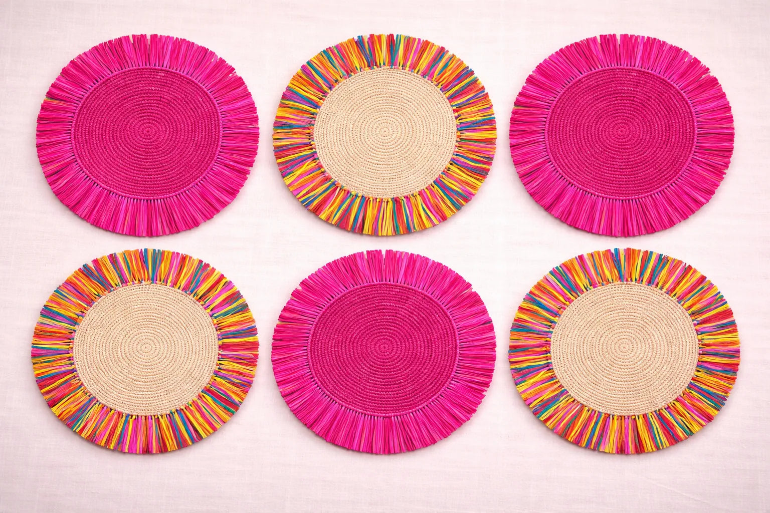 Confetti Sprinkles festive table setting featuring multicolored handwoven charger plates and playful bohemian party accessories.