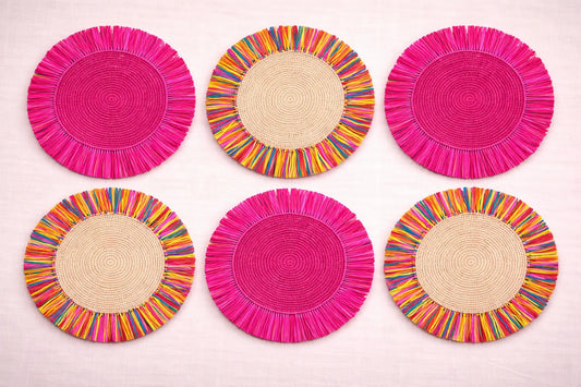 Confetti Sprinkles festive table setting featuring multicolored handwoven charger plates and playful bohemian party accessories.