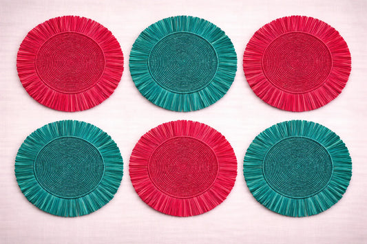 Holiday Cheer festive table setting featuring a handwoven charger plate with Christmas-themed in red and green bohemian accessories.