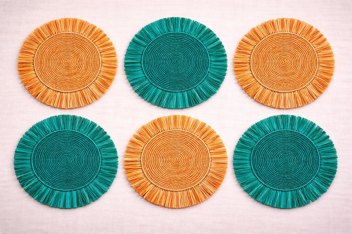 Citrus Grove table setting featuring a yellow or orange handwoven charger plate in orange and green.