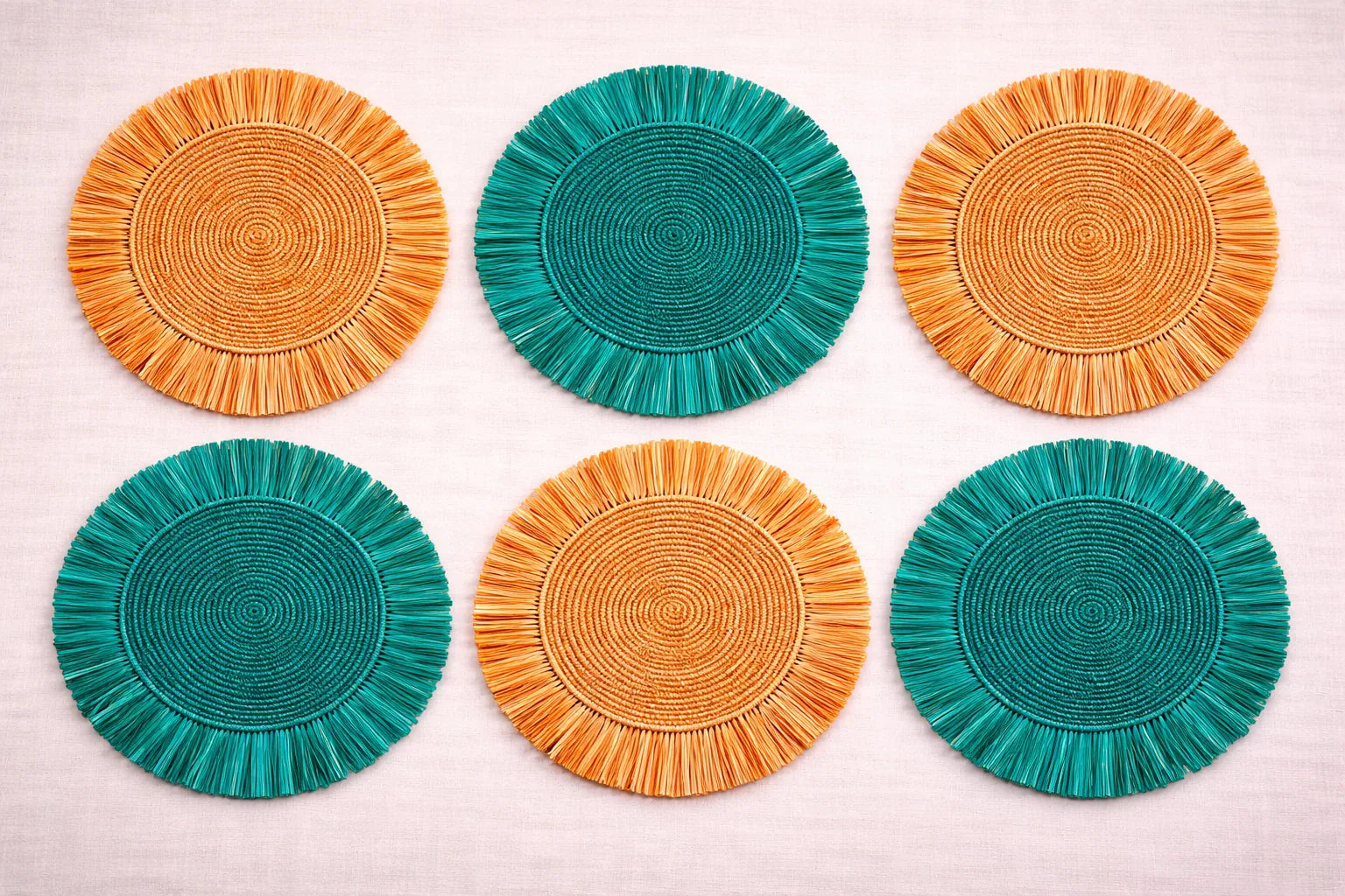 Citrus Grove table setting featuring a yellow or orange handwoven charger plate in orange and green.